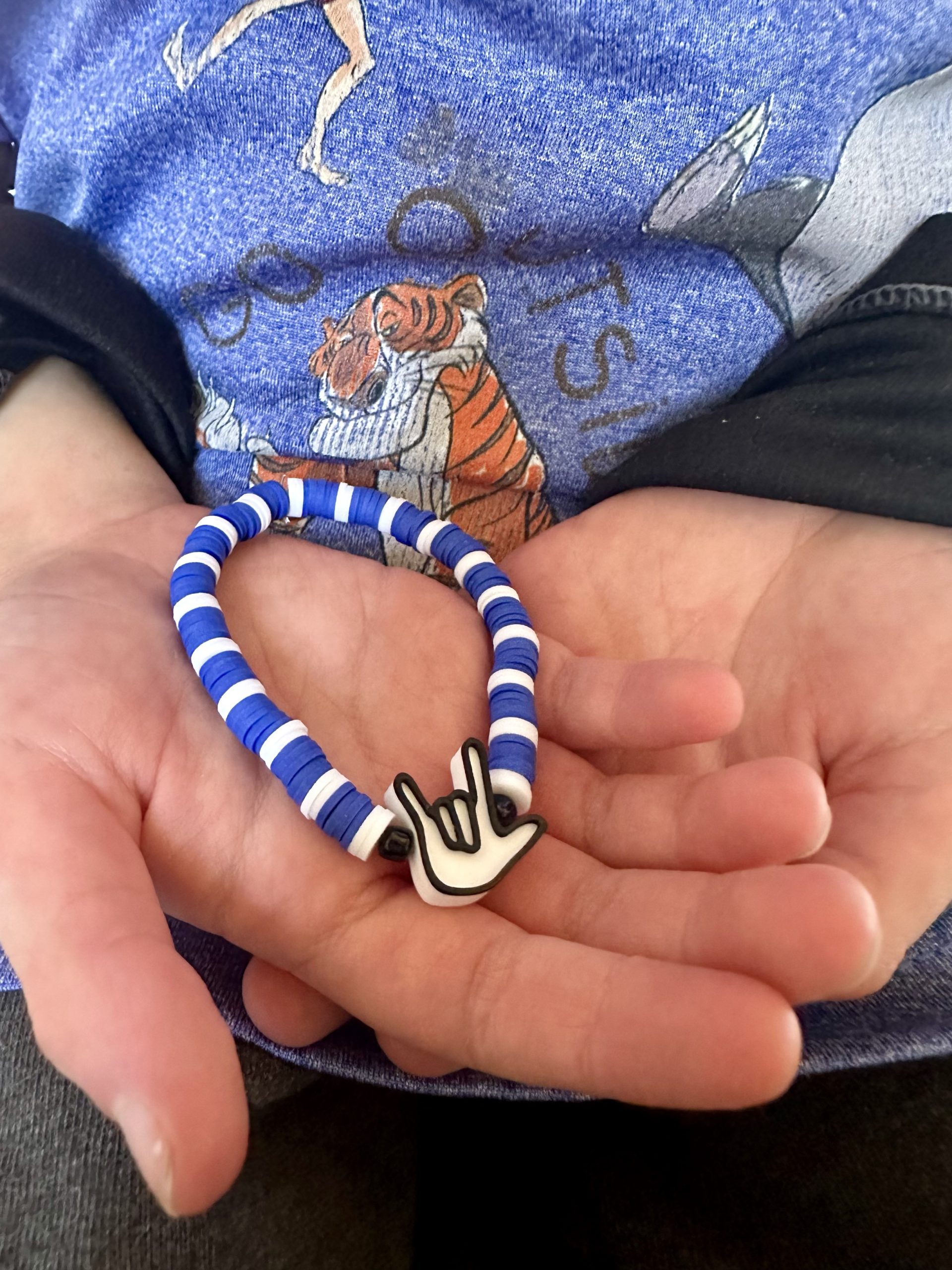 White and blue bracelet with ASL I Love You bead