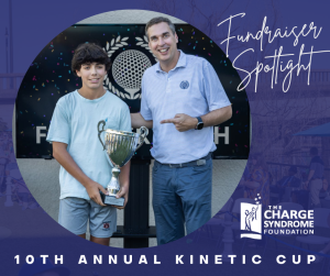 Young man poses with trophy
