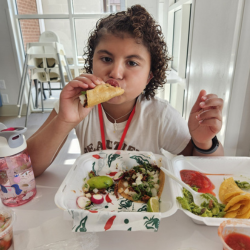 Girl with CHARGE enjoying lunch